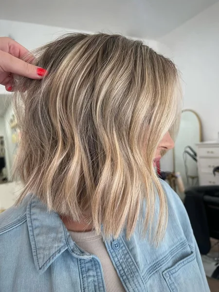 Sleek Sandy Blonde A-Line Bob with Face-Framing Graduation