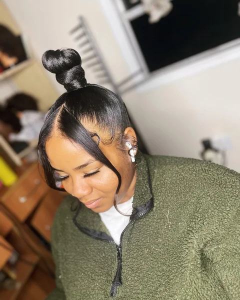 Sleek Sculpted Top Knot with Dramatic Side-Swept Bangs