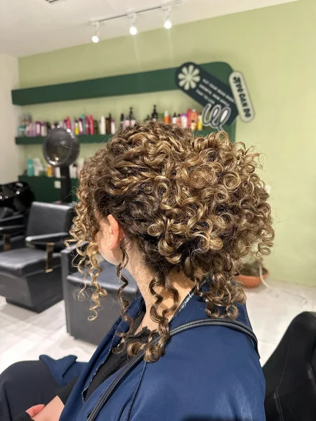 Sun-Kissed Golden Curls in a Cascading Updo
