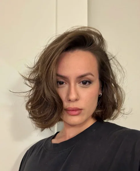 Voluminous Brunette Bob with Swept-Back Layers