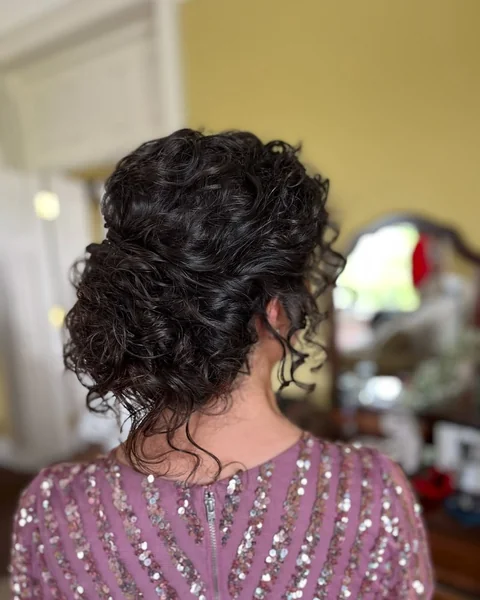 Voluminous Dark Curls with Intricate Nape Detail