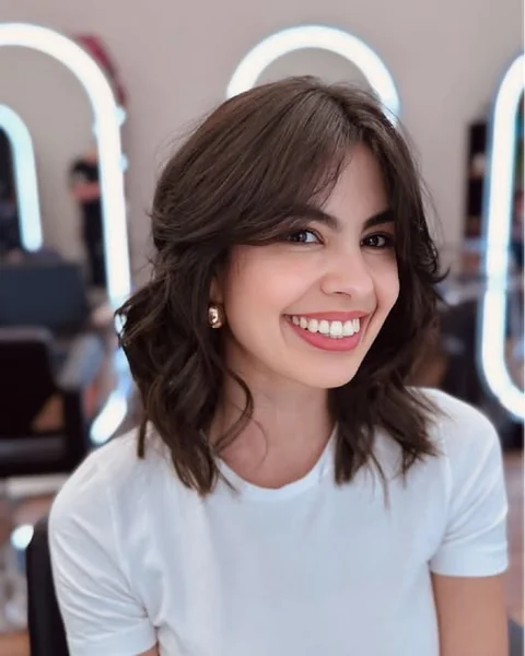 Brunette Butterfly Bob with Airy Face-Framing Layers