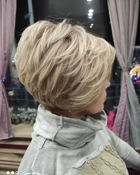 Champagne Blonde Stacked Bob with Wispy Feathered Layers