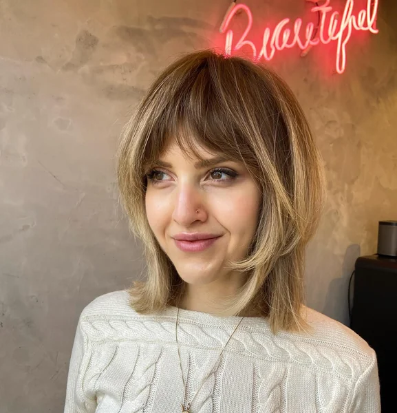 Chic Honey-Blonde Wolf Cut with Airy Curtain Bangs