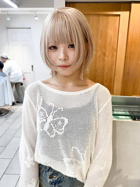 Medium Ash Blonde Wolf Cut with Airy Curtain Bangs
