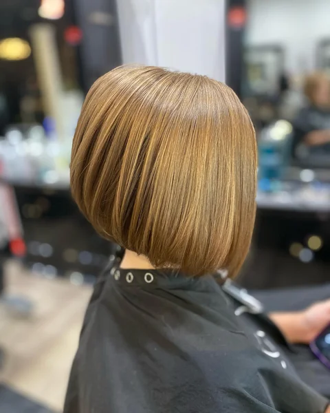 Sleek Honey-Blonde Angled Bob with Internal Layers