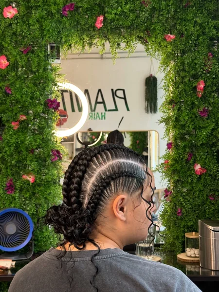 Cornrows into Low Curly Bun