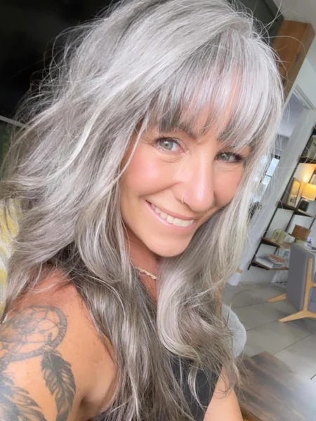 Wavy Layered Long Hair with Bangs for Women Over 60