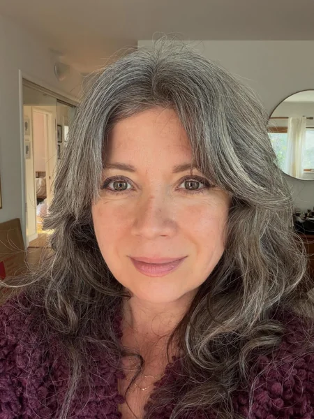 Long Layered Gray Hairstyle with Bangs