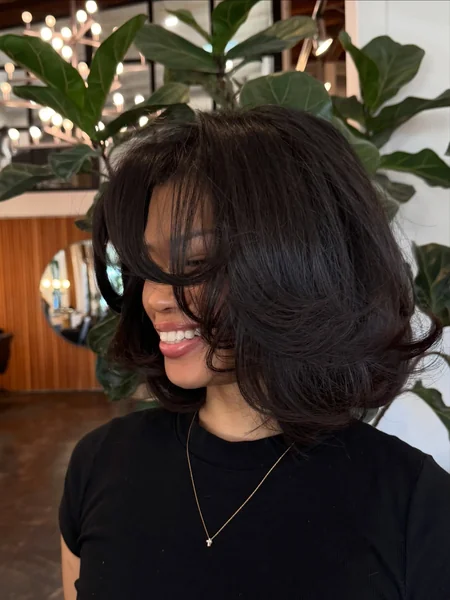 Voluminous Layered Bob with Bangs for Fine Hair