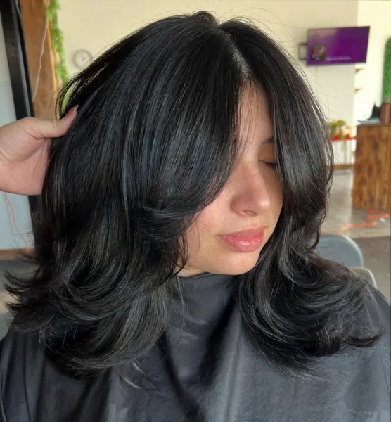 Deep Side-Part Layered Cut for Dark Hair