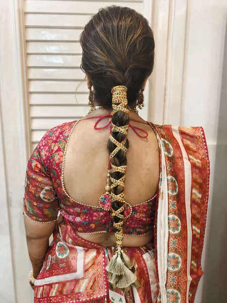 Braided Ponytail with Thread Wrap and Tassels
