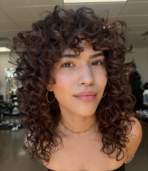 Curly Shag Haircut with Curtain Bangs
