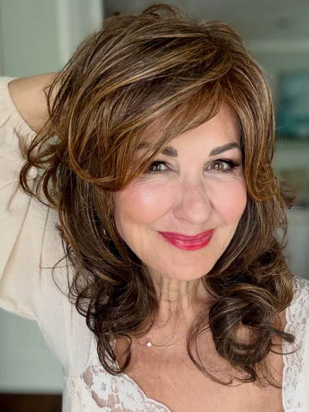 Curly Layers with Face-Framing Bangs