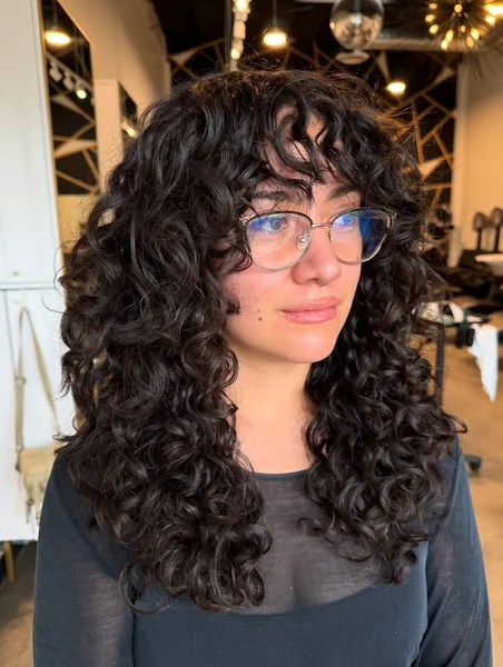 Dark Curly Shag with Full Bangs
