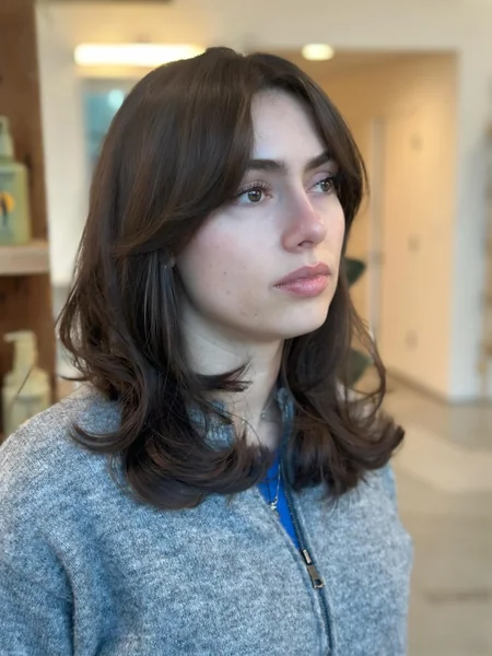 Side-Swept Layers with Soft Curtain Bangs