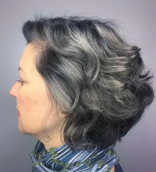 Voluminous Curly Layered Bob in Salt and Pepper