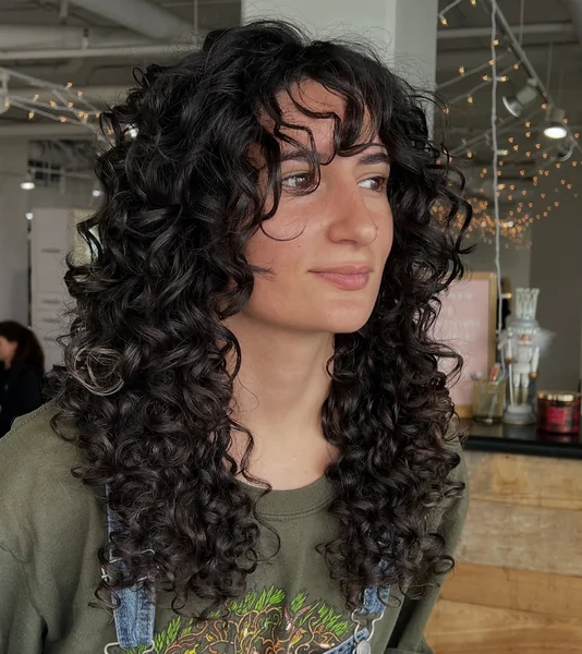 Curly Shag Haircut with Full Fringe