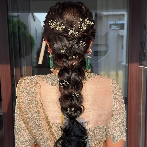 Braid with Baby's Breath Woven Through