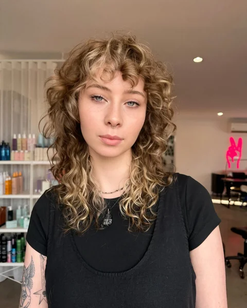 Blonde Curly Shag with Curtain Bangs