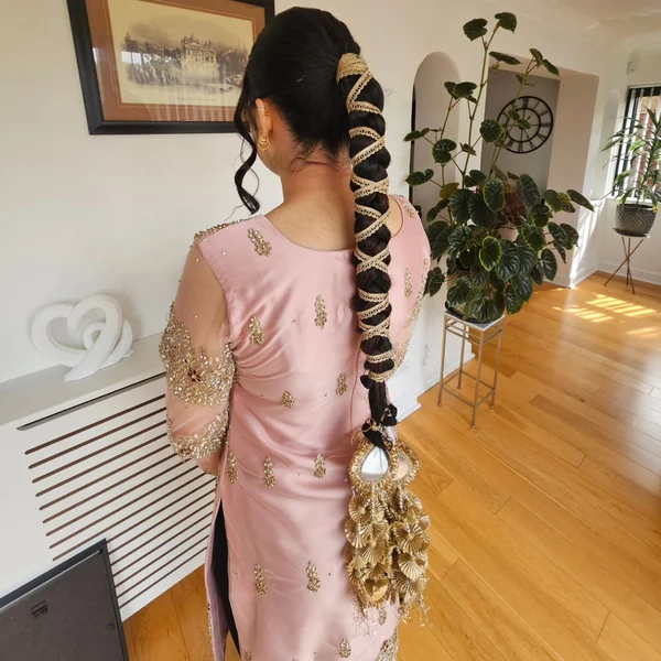 Braided Ponytail with Gold Ribbon and Tassels