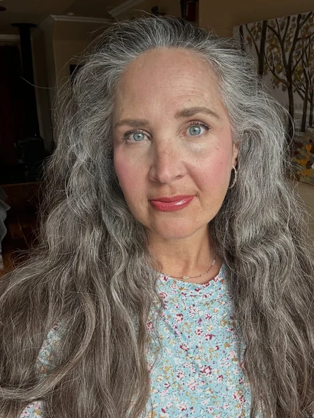 Long Wavy Gray Hairstyle with Bangs for Women Over 60