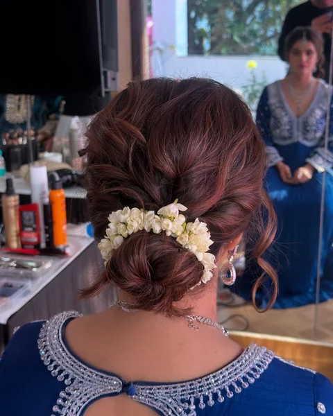 Low Bun with Layered Jasmine Flowers