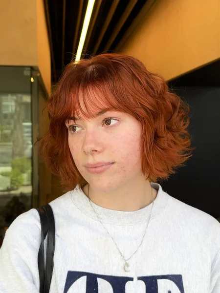 Copper Wavy Bob with Longer Wispy Bangs