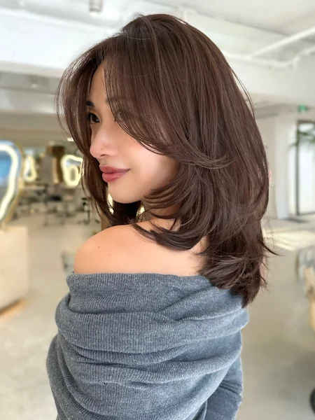 Side-Bang Layered Haircut for Medium Hair