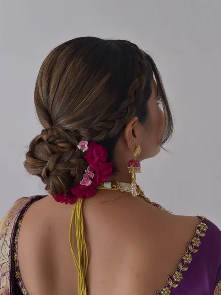 Braided Low Bun with Rose Accents