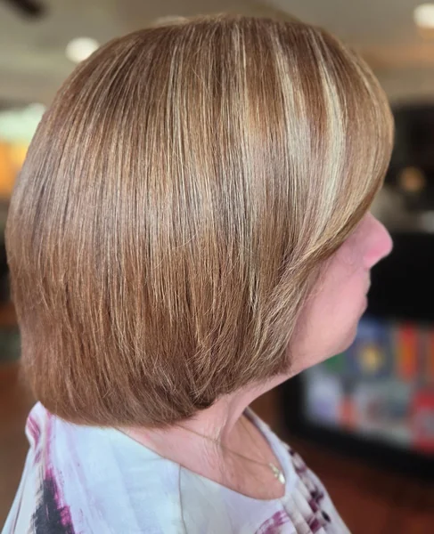 Warm Blonde Layered Bob with Side Sweep