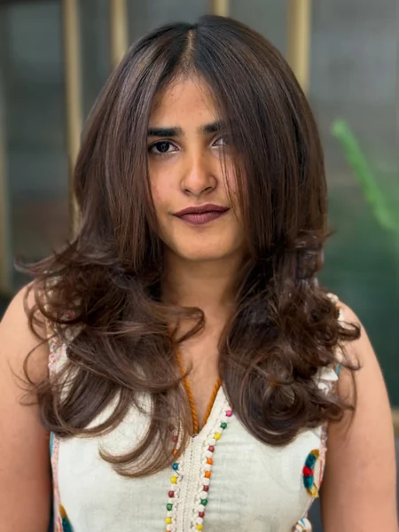Bouncy Layered Haircut with Full Curls