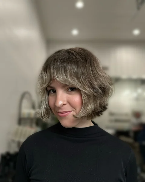 Ash Blonde Wavy Bob with Wispy Bangs