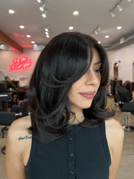 Side-Swept Layered Haircut for Dark Hair