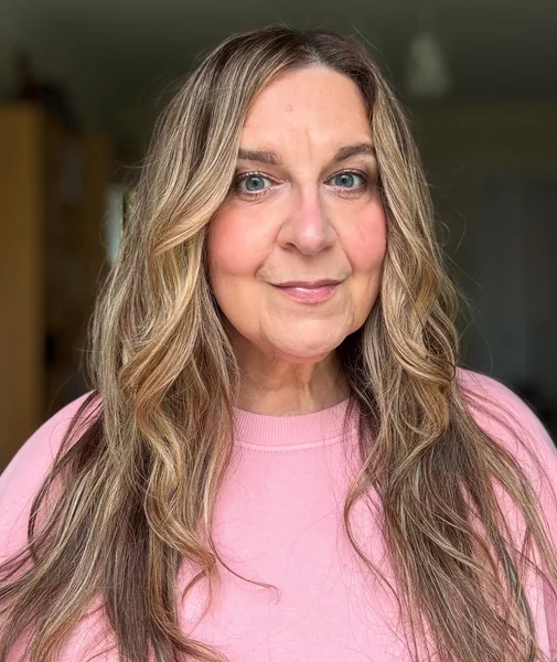 Long Wavy Blonde Hairstyle for Women Over 50