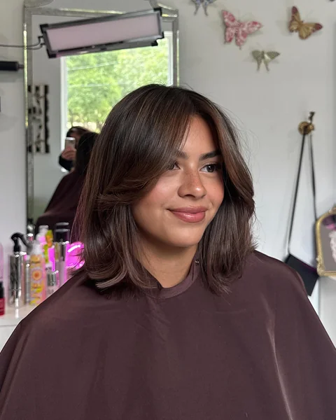 Layered Bob with Curtain Bangs for Fine Hair