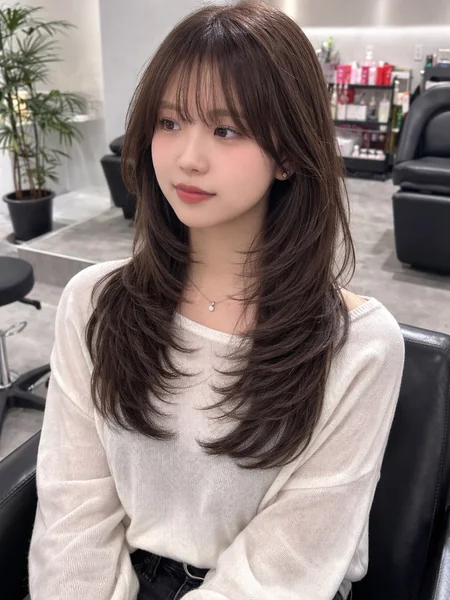 Oval Face Layered Haircut with Long Side-Swept Bangs