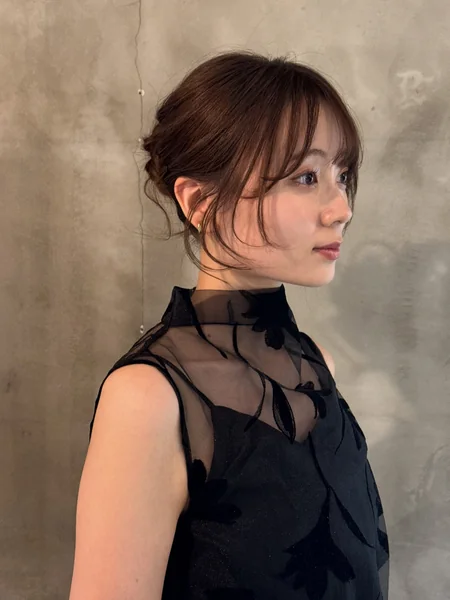 Japanese Low Bun Updo Hairstyle with Bangs