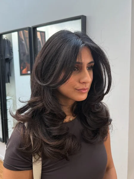 Oval Long Layered Haircut with Bouncy Curls
