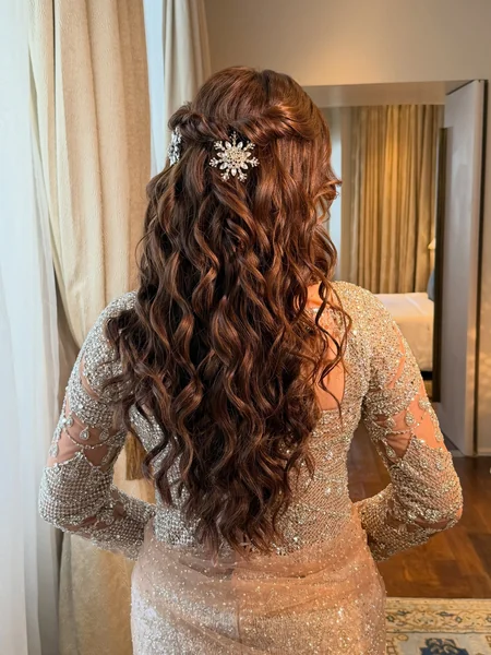 Half-Up Curls with Floral Hairpiece for Reception