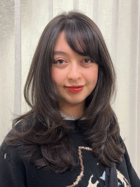 Curtain Bangs with Face-Framing Layers