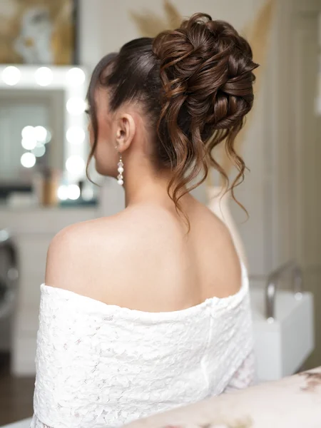 Curly Bun with Pearl Earrings