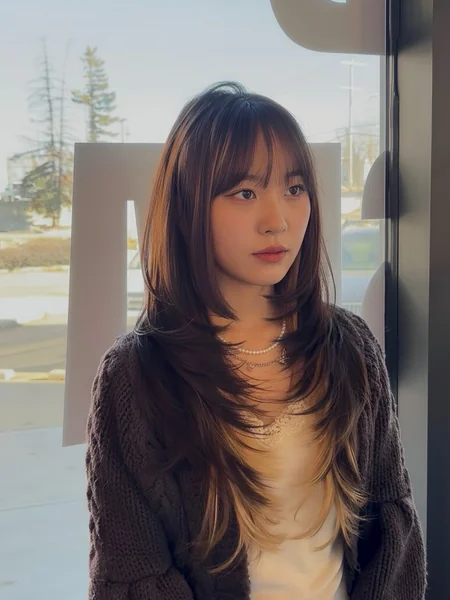 Oval Face Layered Haircut with Bangs