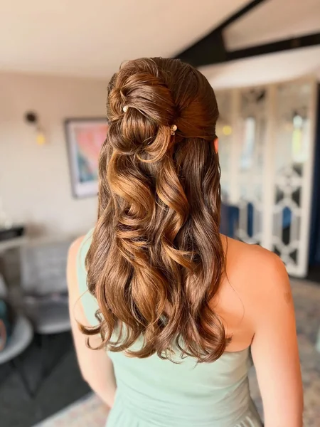 Half-Up Twisted Bun with Loose Curls