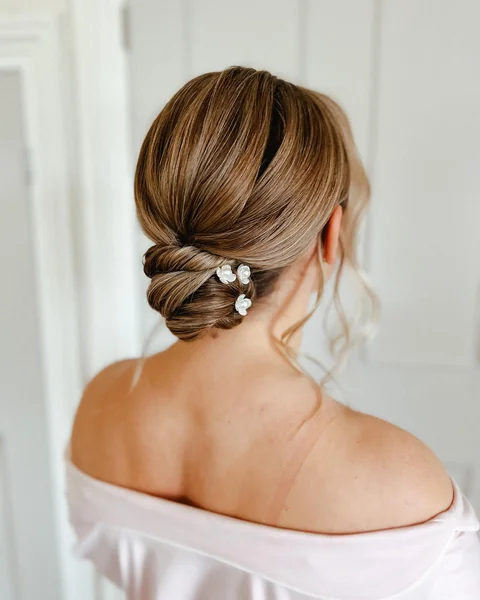 Sleek Low Bun with Flower Pins