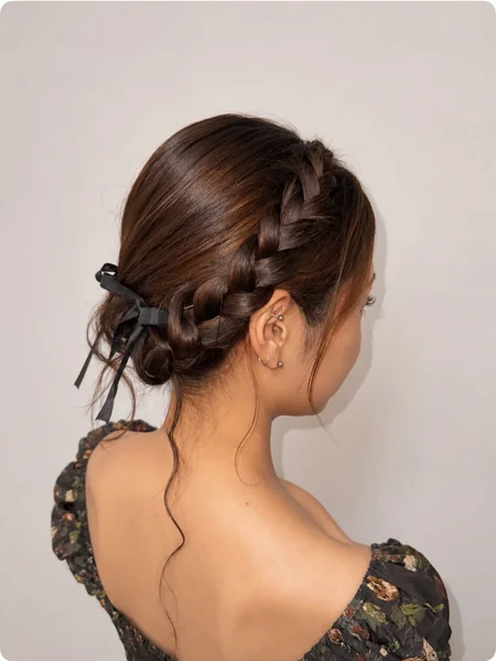Braided Low Bun with Black Ribbon