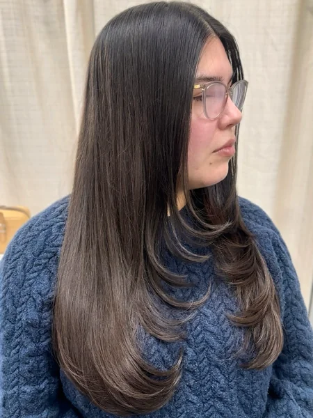 Oval Long Layered Haircut with Sleek Side Part