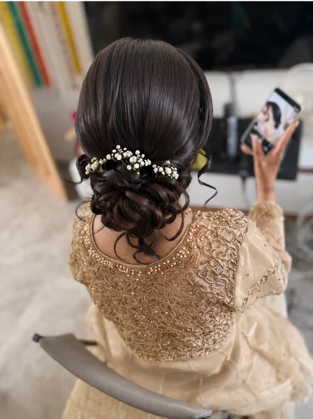 Low Bun with Baby's Breath for Reception