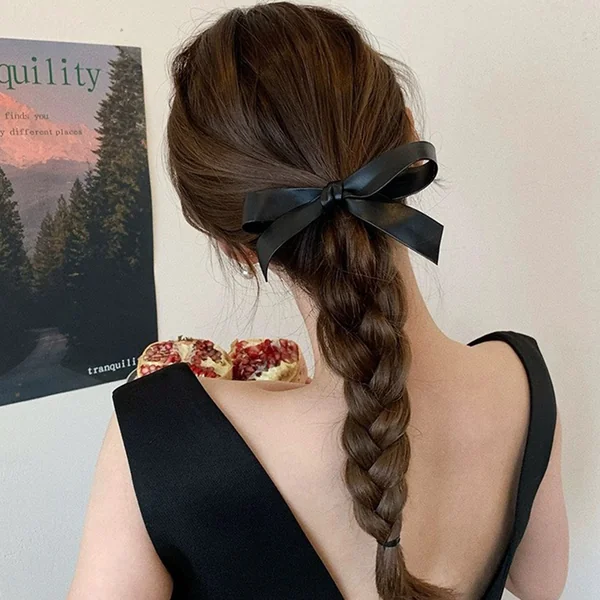 Braided Ponytail with Black Ribbon Bow