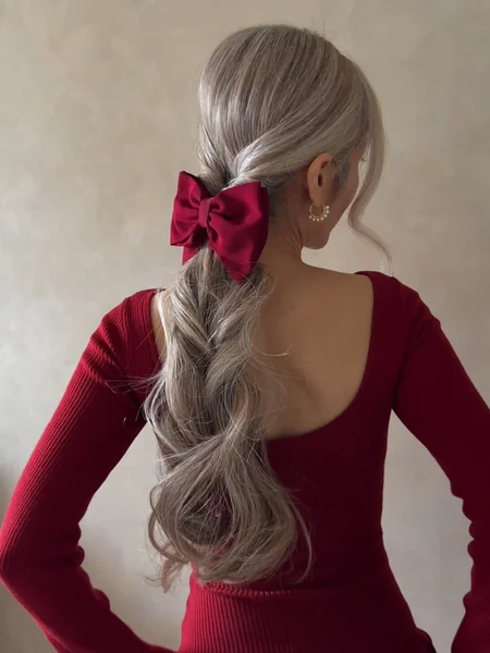 Twisted Ponytail with Red Ribbon Bow